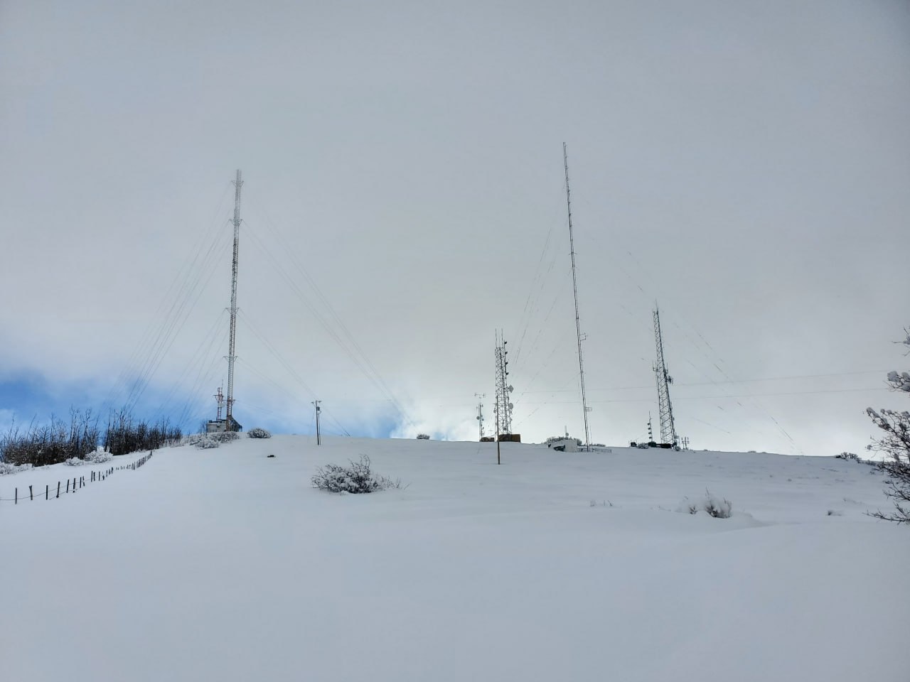 Snowy repeater towers on a western Colorado ridge